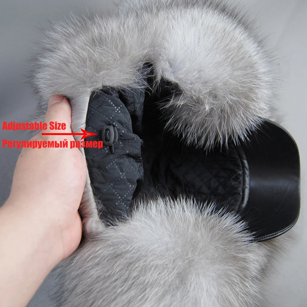 A genuine silver fox fur hat with ear flaps a genuine natural fur hat suitable for Russian womens bomber hats and a trap hat with a genuine leather to
