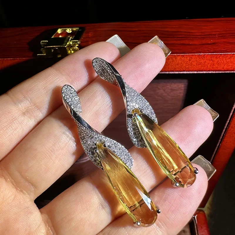 Yellow crystal large water droplet pendant earrings suitable for womens birthday parties banquet dress accessories perforated needles Christmas gifts 