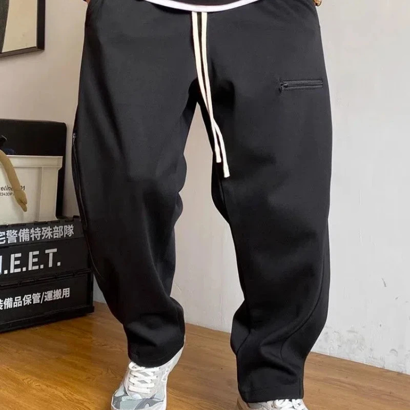 Spring and autumn mens solid color elastic high waist pocket zipper casual fashion goods drawstring pants 241030
