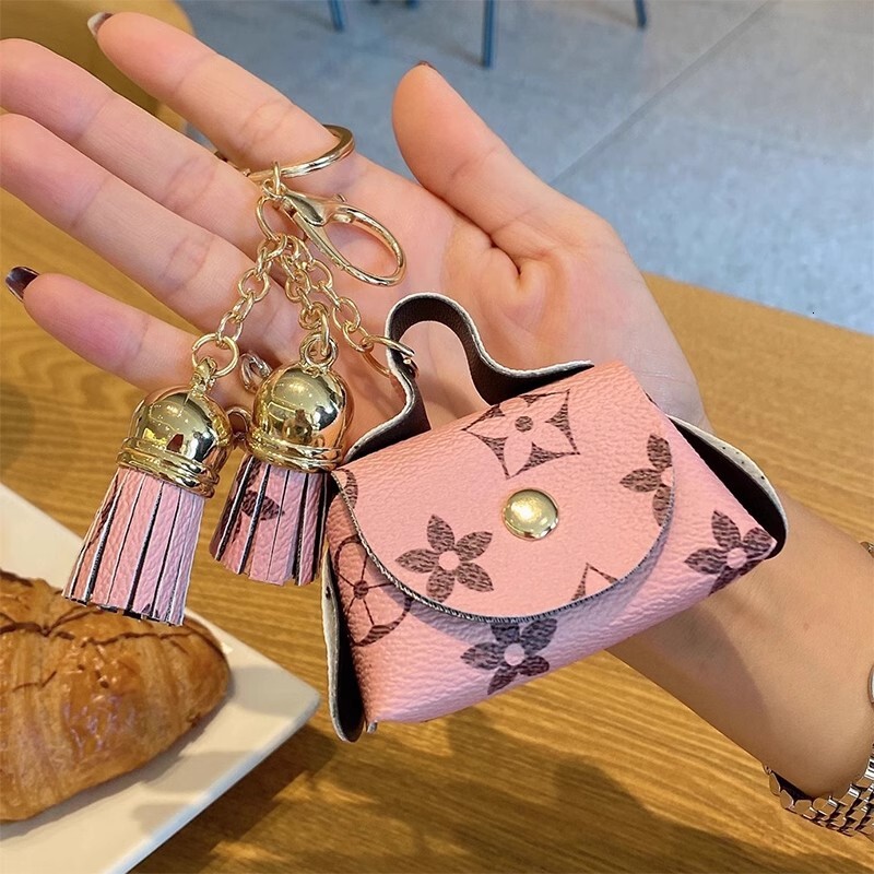 New designer's cute mini leather coin purse, headphone storage, old flower pendant, card bag, women's key bag