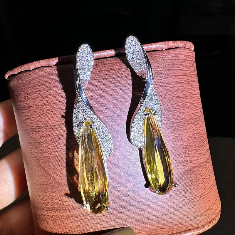 Yellow crystal large water droplet pendant earrings suitable for womens birthday parties banquet dress accessories perforated needles Christmas gifts 