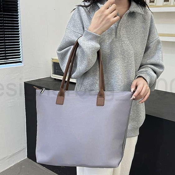 Bag Designer Fashion Classic 10a Top Woman Handbagevening Bags New Minimalist Womens Handbag Tote Versatile Waterproof Oxford Cloth Shoulder Armpit