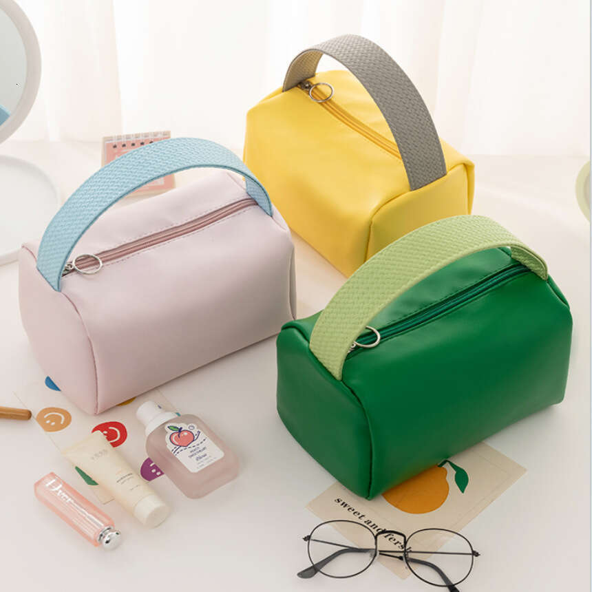 Candy Colored PU Waterproof Travel Toiletry Bag with Large Capacity for Handheld Use