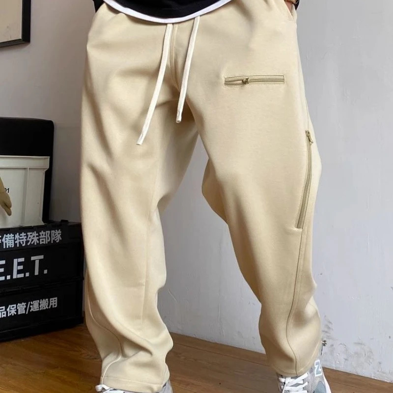 Spring and autumn mens solid color elastic high waist pocket zipper casual fashion goods drawstring pants 241030