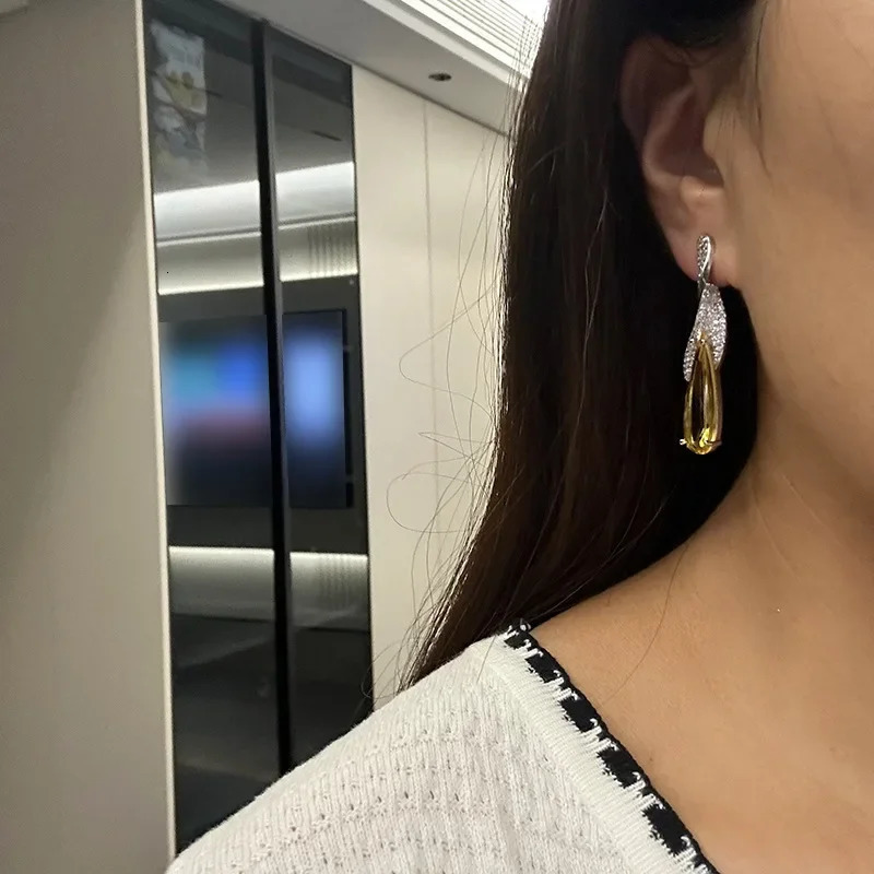 Yellow crystal large water droplet pendant earrings suitable for womens birthday parties banquet dress accessories perforated needles Christmas gifts 