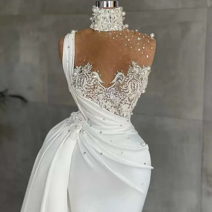 2023 Designer Mermaid Dresses Lace Applique Beaded Pearls Rhies Illusion High Neck Sweep Train Satin Custom Made Wedding Gown Vestido De Novia