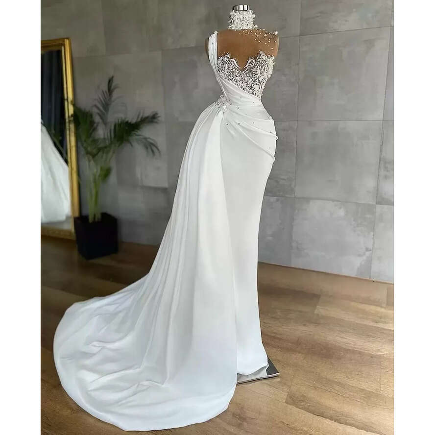 2023 Designer Mermaid Dresses Lace Applique Beaded Pearls Rhies Illusion High Neck Sweep Train Satin Custom Made Wedding Gown Vestido De Novia