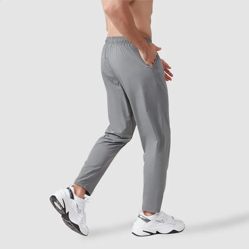 Spring and autumn mens track and field clothes sports pants loose elastic waist fast drying training solid runner breathable casual straight pants 241