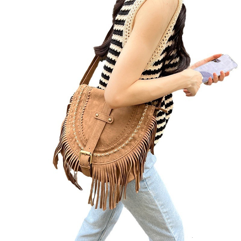 trend 2025NEW New designer tassel imitation suede saddle fashion trend versatile single shoulder diagonal fashion hanging women s bag fashion bag