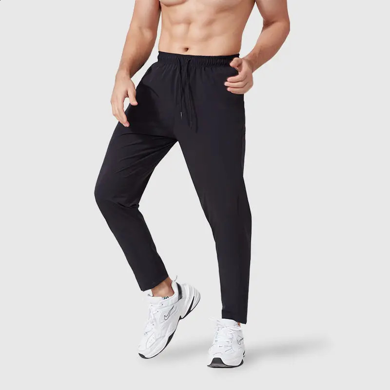 Spring and autumn mens track and field clothes sports pants loose elastic waist fast drying training solid runner breathable casual straight pants 241
