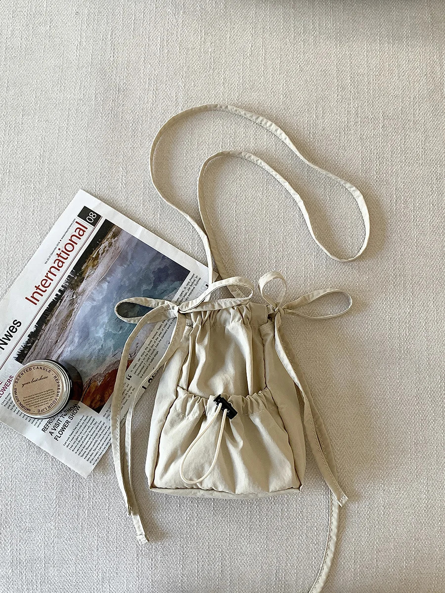 Wuxi womens drawstring small square bag nylon shoulder bag pleated niche cross body bag 241105