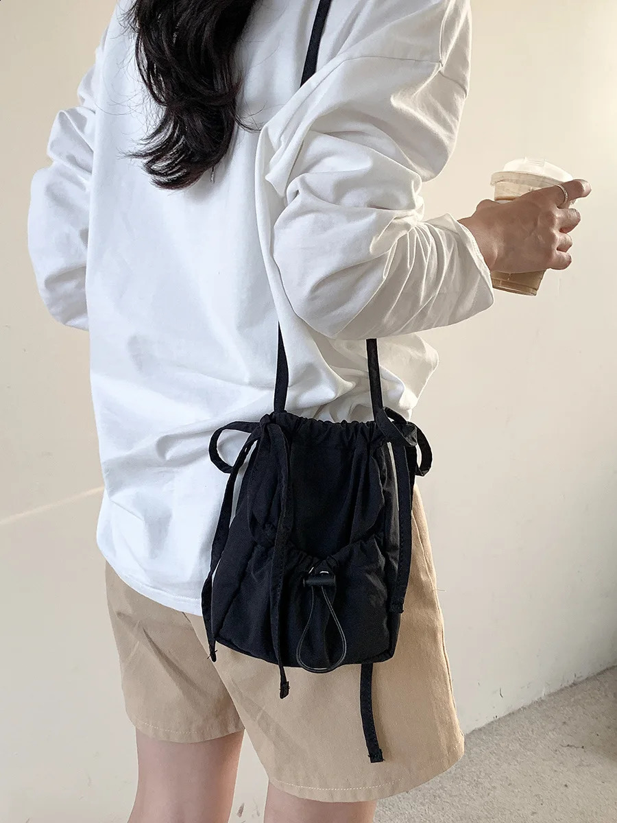 Wuxi womens drawstring small square bag nylon shoulder bag pleated niche cross body bag 241105