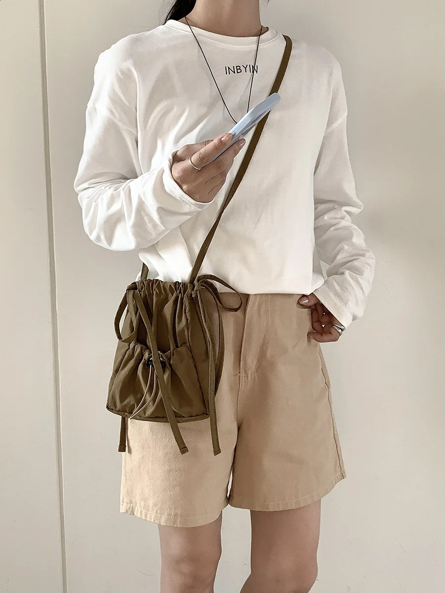 Wuxi womens drawstring small square bag nylon shoulder bag pleated niche cross body bag 241105