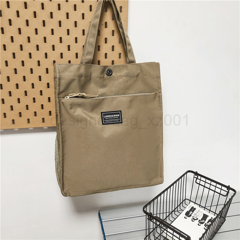 Classic Designer Bag Fashion 10a Top Nikiduncks Woman Mens Handbag Casual Simple Canvas Commuting Tote Shoulder Large Capacity File
