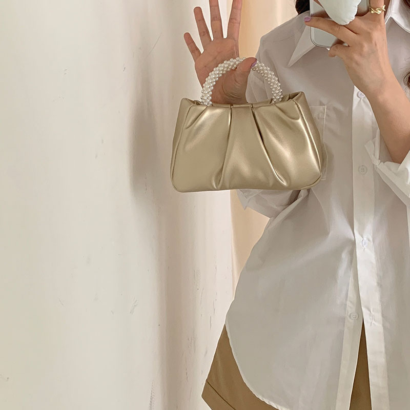 2025NEW New designer s high end French Bailing pearl handbag with a soft and trend fashion sloping body women s cloud bag fashionable bag