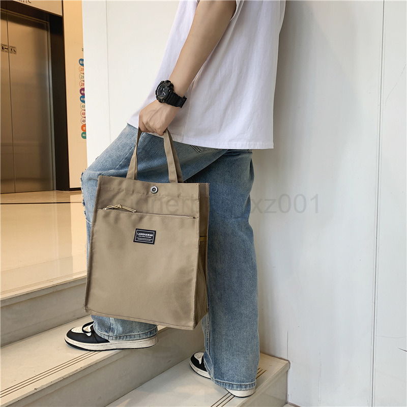 Classic Designer Bag Fashion 10a Top Nikiduncks Woman Mens Handbag Casual Simple Canvas Commuting Tote Shoulder Large Capacity File