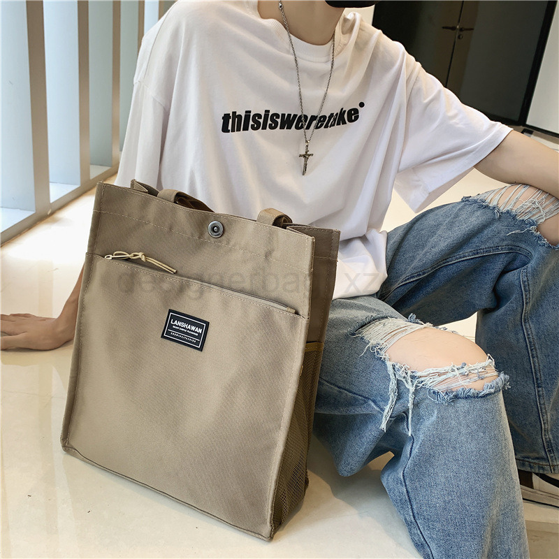 Classic Designer Bag Fashion 10a Top Nikiduncks Woman Mens Handbag Casual Simple Canvas Commuting Tote Shoulder Large Capacity File