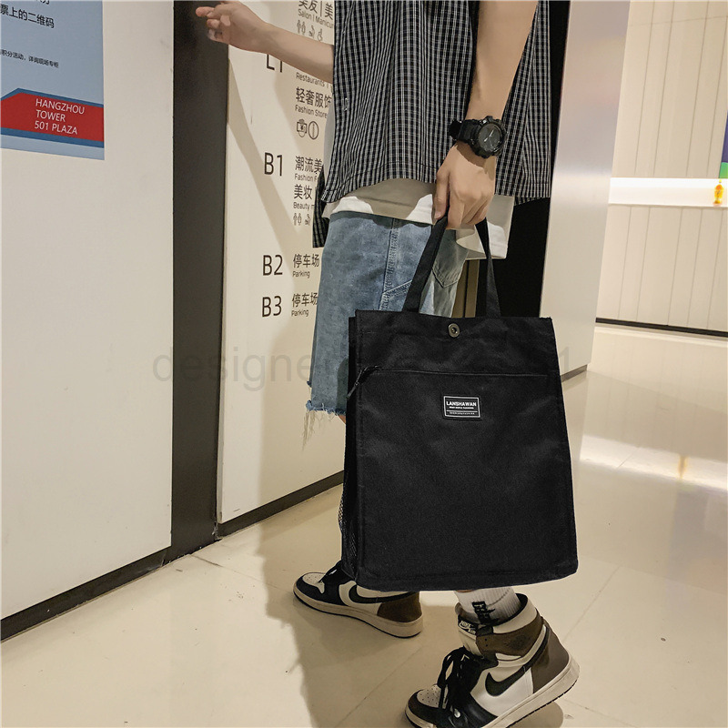 Classic Designer Bag Fashion 10a Top Nikiduncks Woman Mens Handbag Casual Simple Canvas Commuting Tote Shoulder Large Capacity File