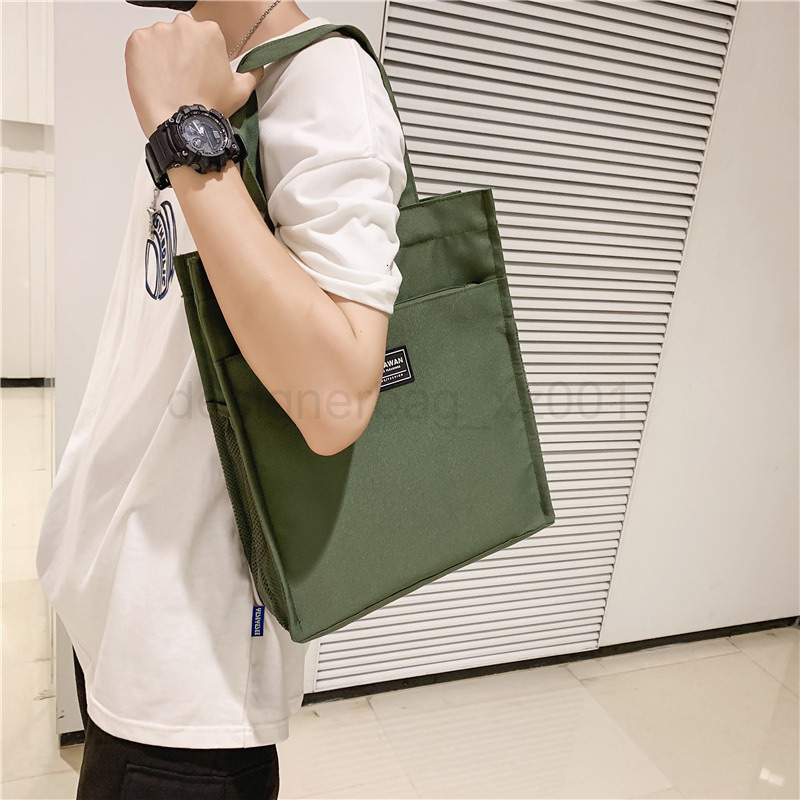 Classic Designer Bag Fashion 10a Top Nikiduncks Woman Mens Handbag Casual Simple Canvas Commuting Tote Shoulder Large Capacity File