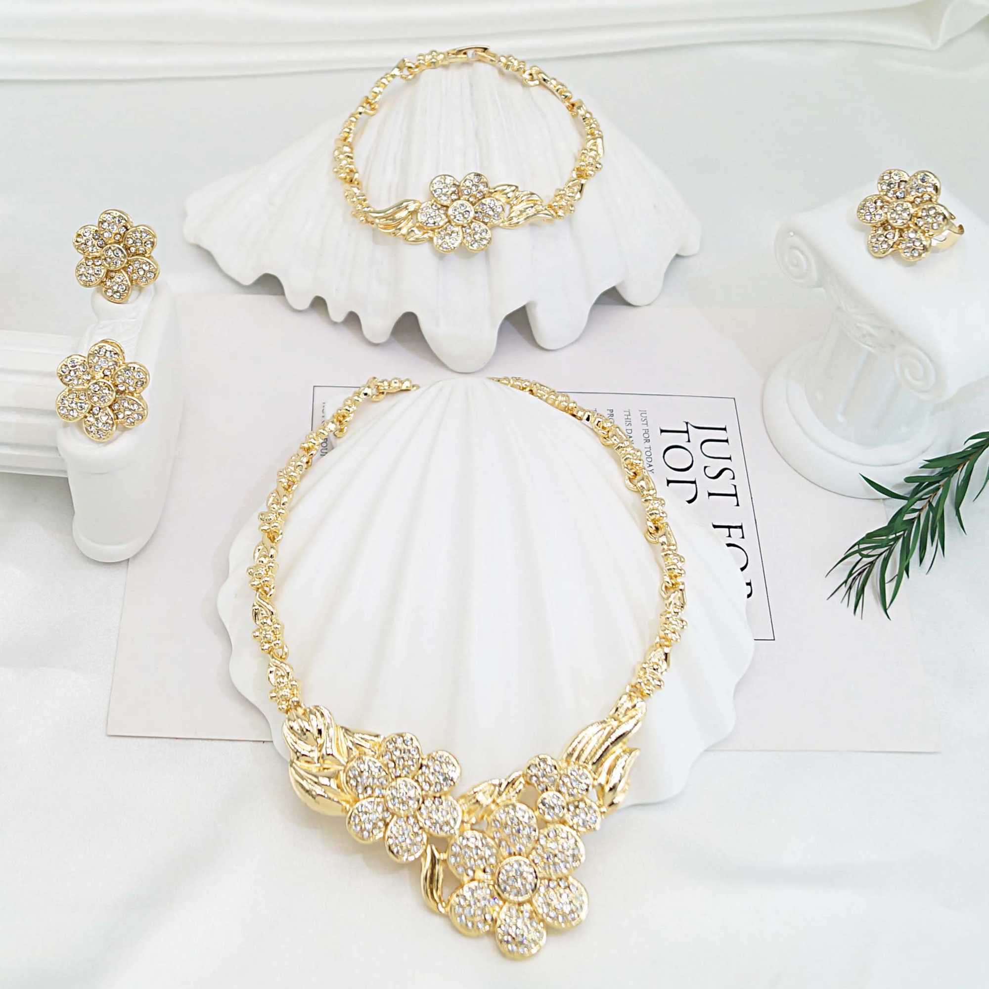 Elegant Wens jewelry set featuring exquisite flower pendant necklaces earrings rings and gold-plated bracelets as holiday gifts X241106