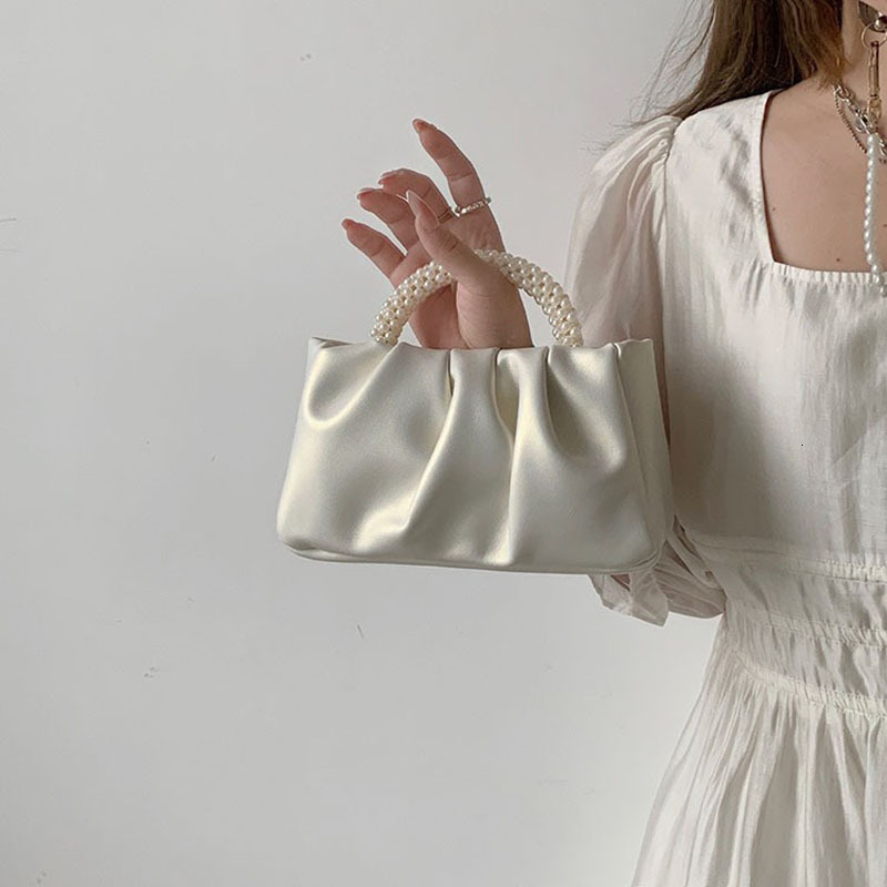 2025NEW New designer s high end French Bailing pearl handbag with a soft and trend fashion sloping body women s cloud bag fashionable bag