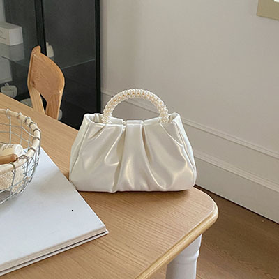 2025NEW New designer s high end French Bailing pearl handbag with a soft and trend fashion sloping body women s cloud bag fashionable bag