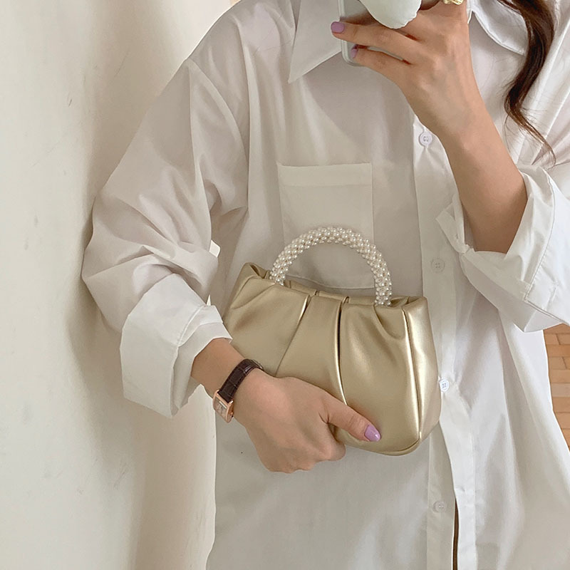 2025NEW New designer s high end French Bailing pearl handbag with a soft and trend fashion sloping body women s cloud bag fashionable bag