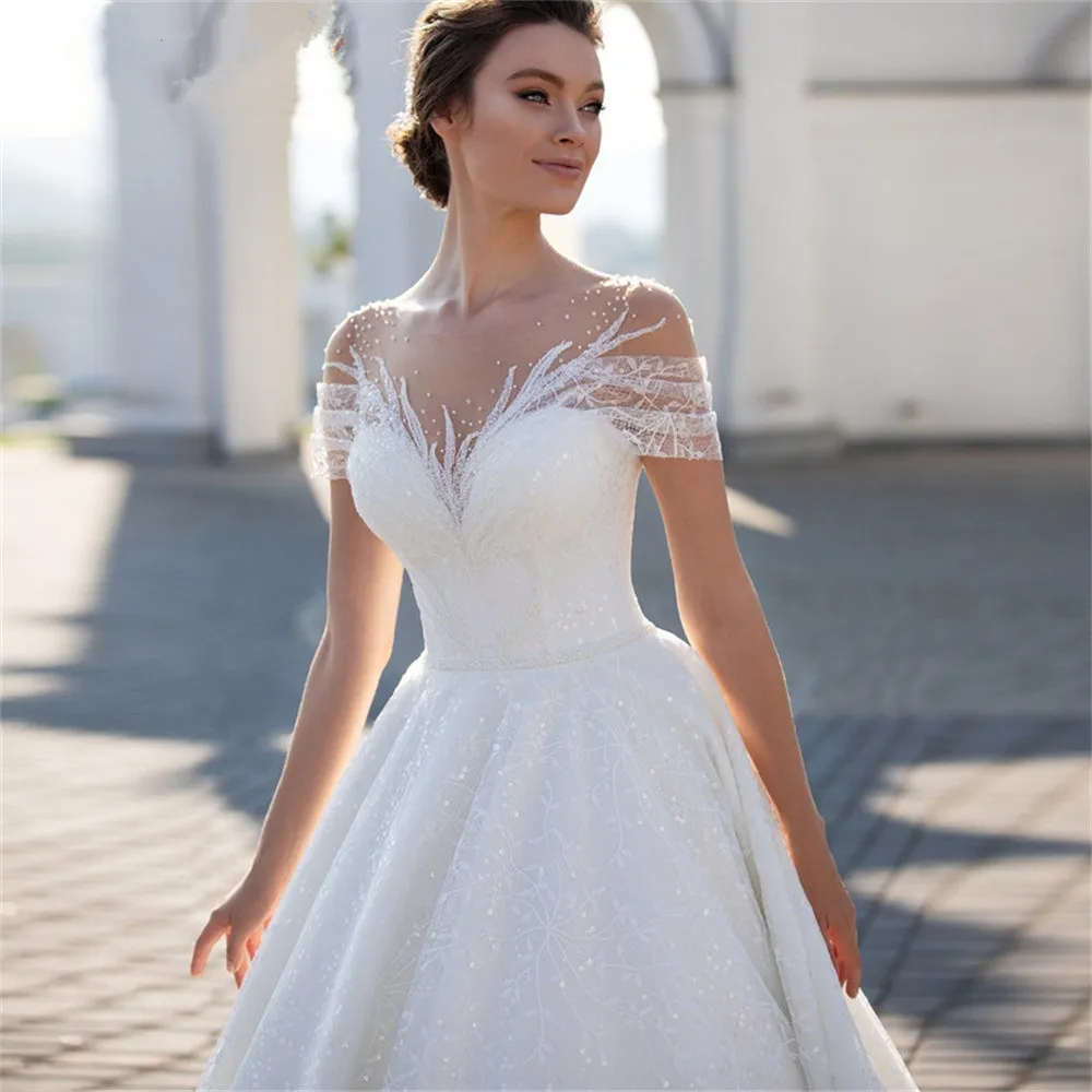 Modern A-Line Wedding Dresses Cape Sleeves V Neck Hollow Lace Appliqued Sequins Floor Length Hollow Backless Shiiny Tulle Lace Plus Size Boho Wedding 