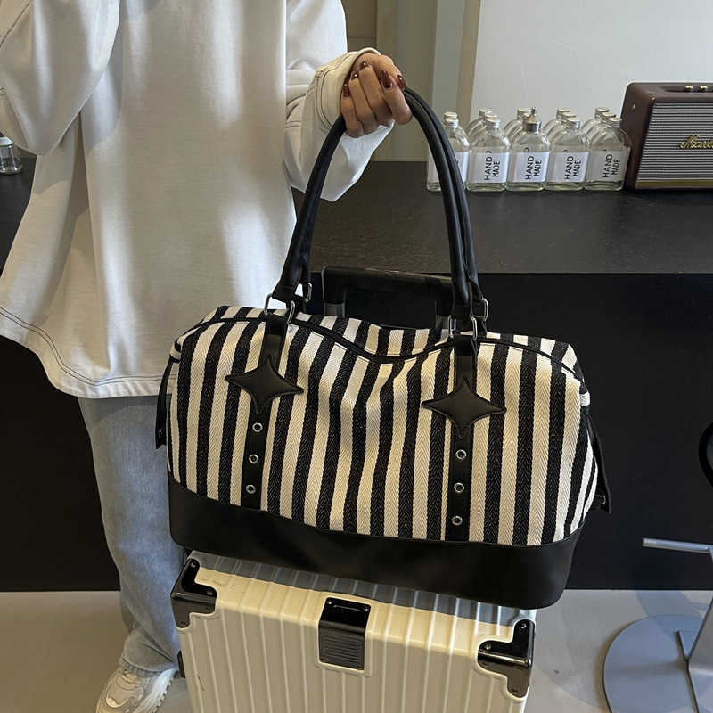 Fashion striped casual yoga bag for women, Korean version, trendy sports and fitness bag, short distance business trip, boarding travel bag 241107