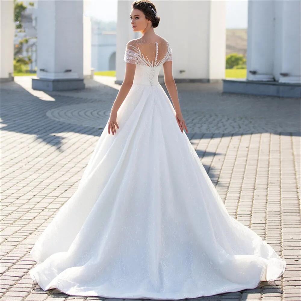 Modern A-Line Wedding Dresses Cape Sleeves V Neck Hollow Lace Appliqued Sequins Floor Length Hollow Backless Shiiny Tulle Lace Plus Size Boho Wedding 