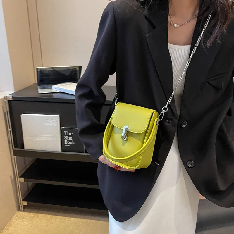 Mini chain cute PU leather cross shaped bag with short handle suitable for womens solid color fashion mobile handbags and wallets 241107