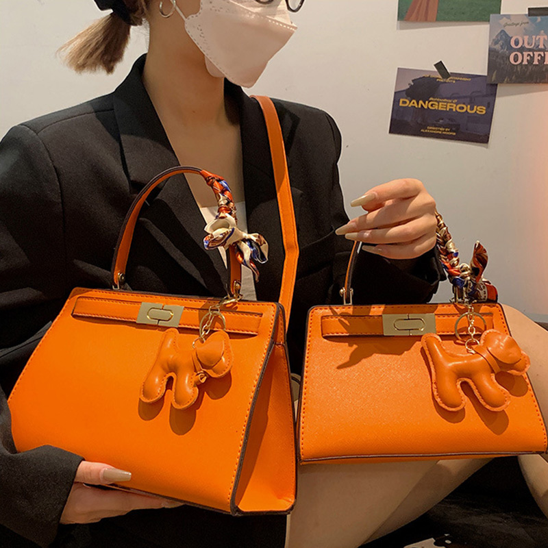 New Senior Luxury Women's Handbag High End Brand Leather Designer Shoulder Bag Lady With Cute Pendant Orange Color Crossbody Bag