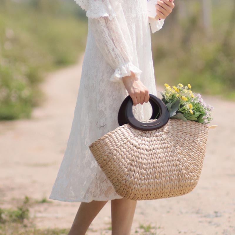Retro simple handmade straw bag Summer new Portable hand bag Women's holiday casual bag