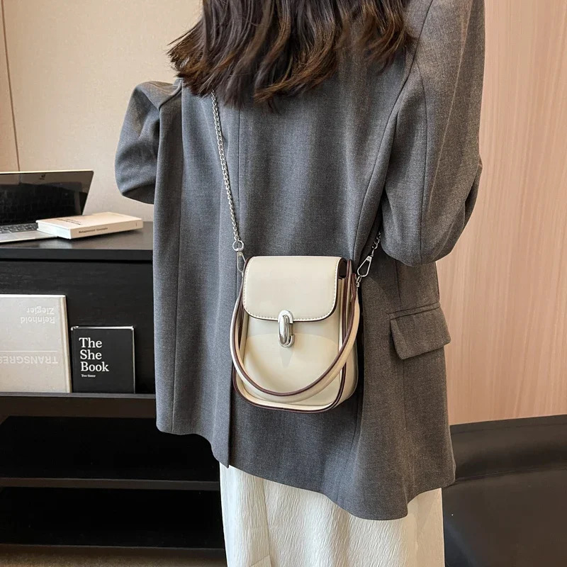 Mini chain cute PU leather cross shaped bag with short handle suitable for womens solid color fashion mobile handbags and wallets 241107