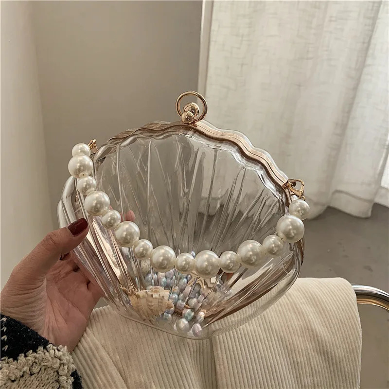 Transparent acrylic shell shaped bag summer high-quality PVC womens er handbag pearl shoulder strap messenger clutch bag 241106