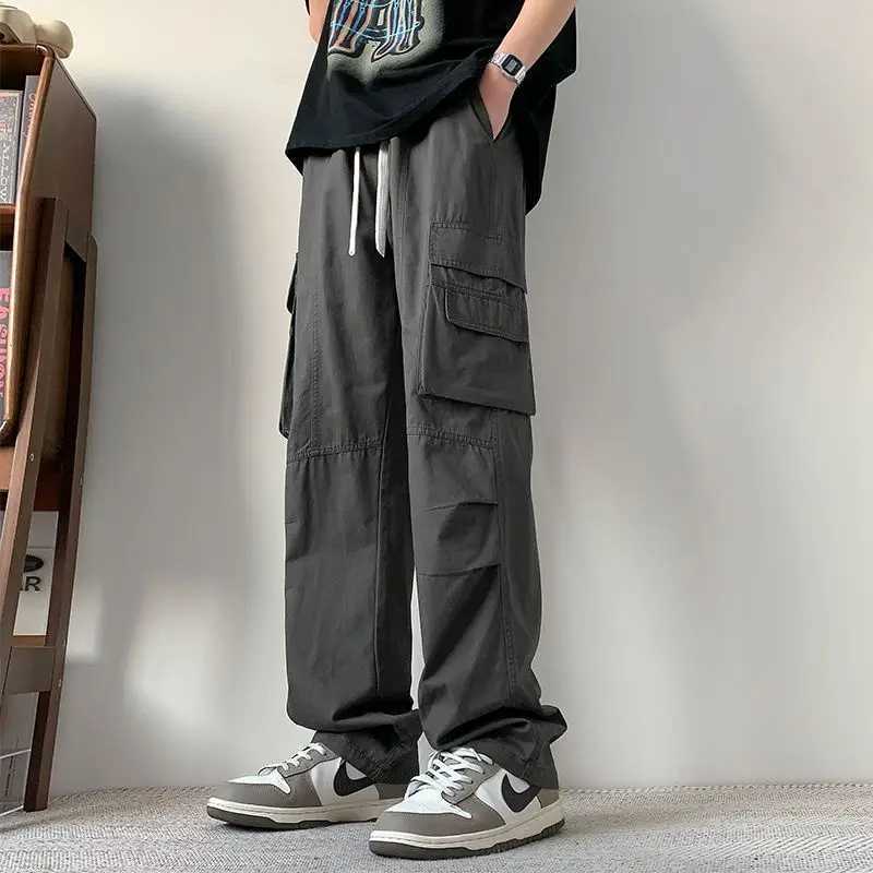 Spring Autumn New Fashion Elastic Waist Drawstring Solid Mens Clothing Casual Pocket Straight Trend Korean Loose Cargo Pants LX241107