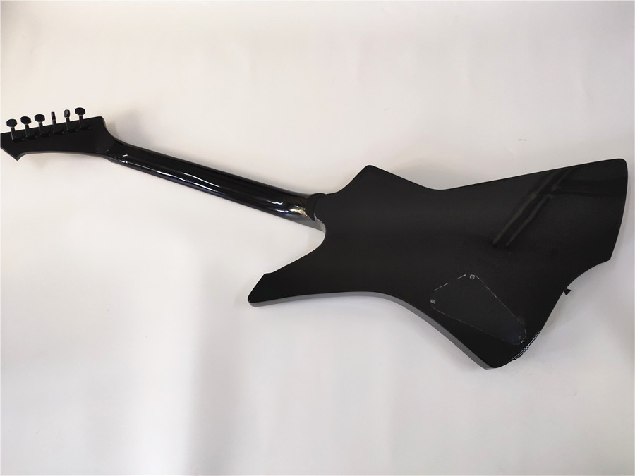 A new high quality custom shaped 6 - string electric guitar with purple and black accessories