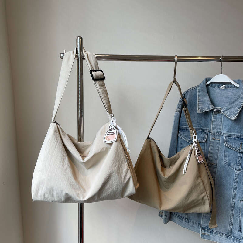 Korean girl lazy single shoulder tote with large capacity and versatile commuting for college students, Sen style hand-held armpit bag