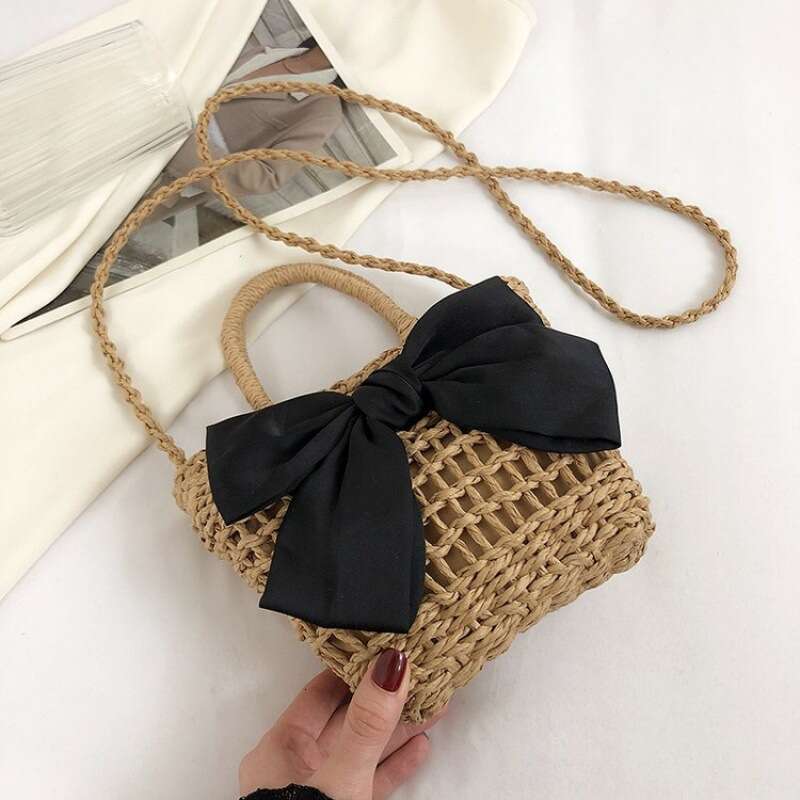 Handheld French niche 2024 new cute bow design sense grass woven beach bucket bag for women