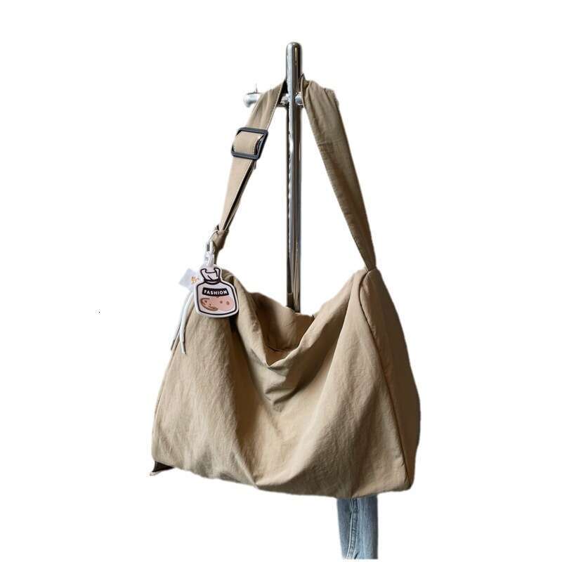 Korean girl lazy single shoulder tote with large capacity and versatile commuting for college students, Sen style hand-held armpit bag