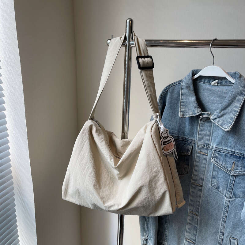 Korean girl lazy single shoulder tote with large capacity and versatile commuting for college students, Sen style hand-held armpit bag