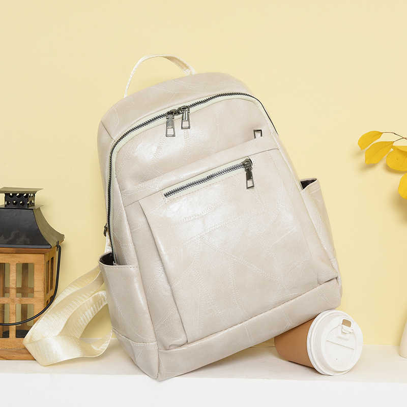 Backpack for women 2023 new casual trend large capacity student bag fashionable and versatile PU soft leather texture backpack
