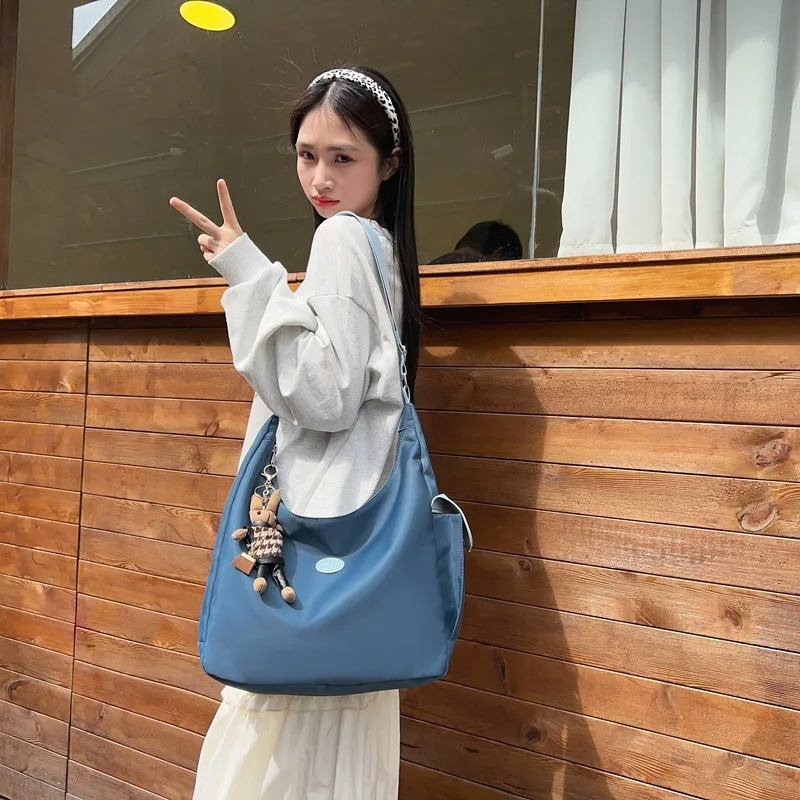 Canvas womens shoulder crossed backpack waterproof and fashionable student messenger bag school handbag 241111