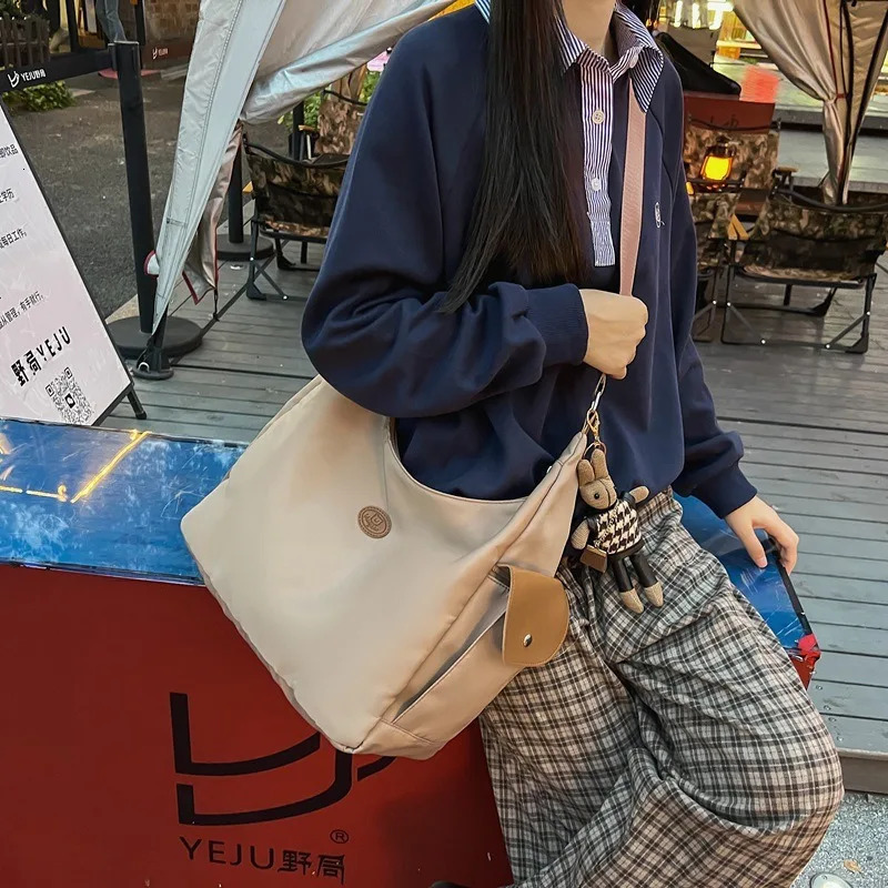 Canvas womens shoulder crossed backpack waterproof and fashionable student messenger bag school handbag 241111