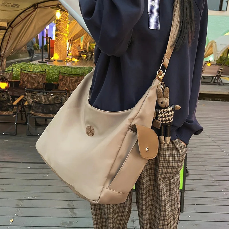 Canvas womens shoulder crossed backpack waterproof and fashionable student messenger bag school handbag 241111