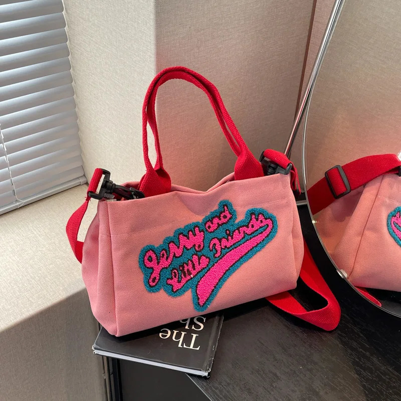 Letters hit color canvas bag pillow womens bag trend fashion shoulder wide shoulder strap cross bag 241111