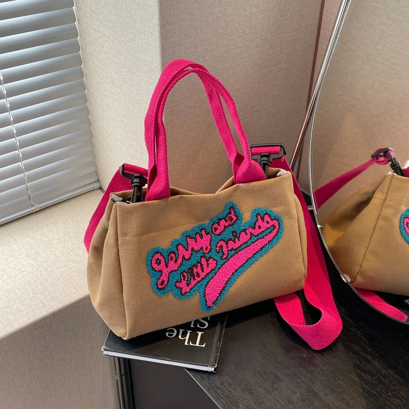 Letters hit color canvas bag pillow womens bag trend fashion shoulder wide shoulder strap cross bag 241111