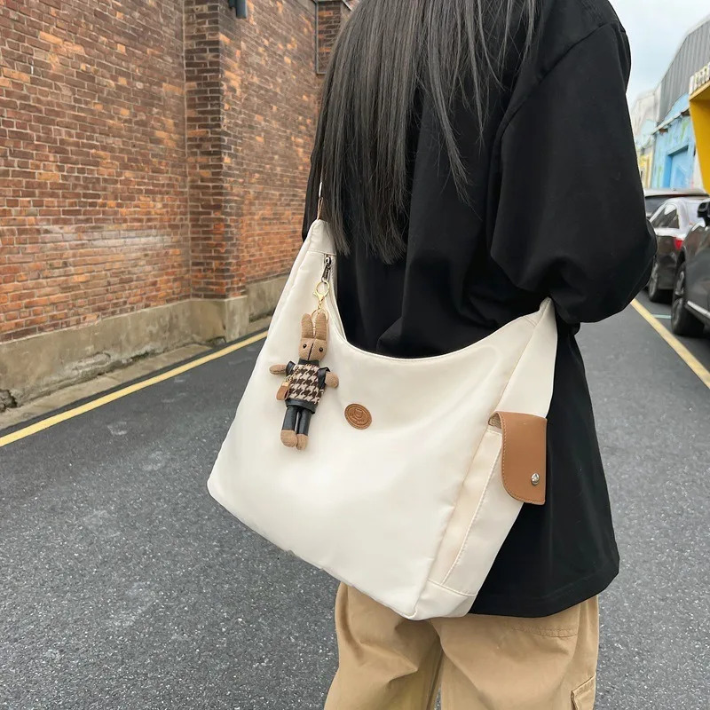 Canvas womens shoulder crossed backpack waterproof and fashionable student messenger bag school handbag 241111