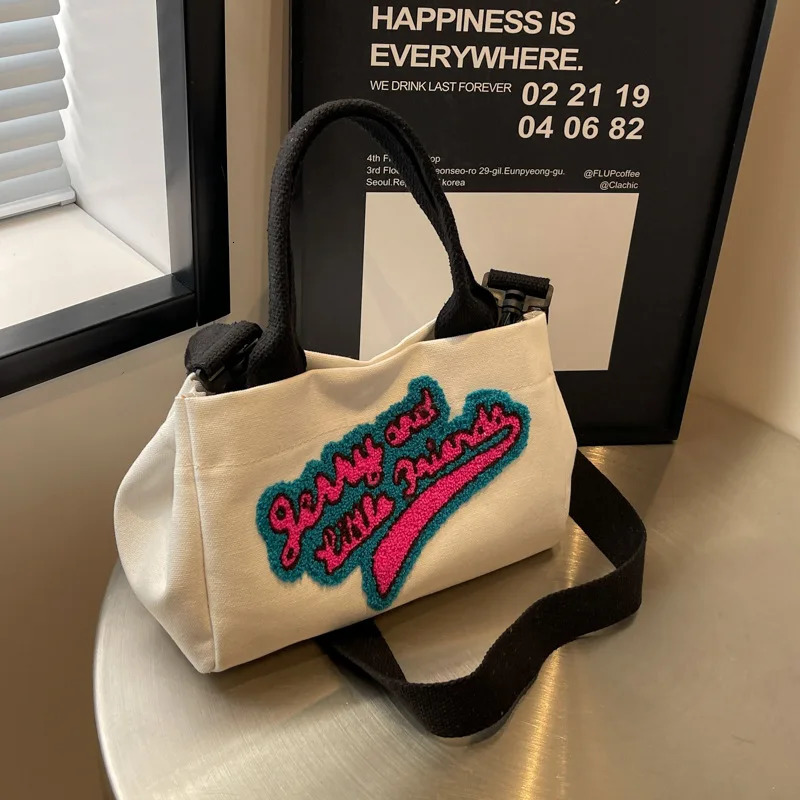 Letters hit color canvas bag pillow womens bag trend fashion shoulder wide shoulder strap cross bag 241111