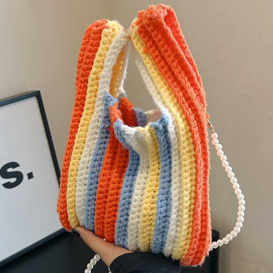 This year's popular large capacity striped contrasting shoulder bag for women, 2024 autumn and winter new yarn knitted hand-held bucket bag
